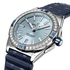 Breitling Super Chronomat Automatic 38 Edelstahl blaues Zifferblatt blaues Kautschukband – Damenuhren Uhr mit Datum aus Edelstahl, Kautschuk und Keramik. Das Gehäuse ist rund und silber. Das Kautschuk / Kunststoff / Silikon Armband ist blau. Das Zifferblatt ist ein Index in blau. – Ansicht 2