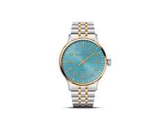 MeisterSinger Yaara Automatik Edelstahl Gold 36mm blaues Zifferblatt Metalllband bicolor – Damenuhren Uhr ohne Datum aus Edelstahl und vergoldet. Das Gehäuse ist rund und silber-gelbgold. Das Edelstahlarmband ist silber-gelbgold. Das Zifferblatt ist arabisch und blau.