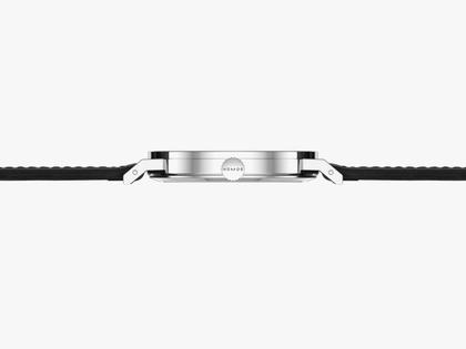 Nomos Glashütte Tangente 2date Handaufzug Edelstahl 38mm blaues Zifferblatt schwarzes Lederband Glasboden – Herrenuhren Uhr mit Datum aus Edelstahl und Leder. Das Gehäuse ist rund und silber. Das Lederarmband ist schwarz. Das Zifferblatt ist arabisch Index und blau. – Ansicht 4