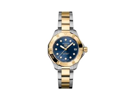 TAG Heuer Aquaracer Professional 200 Solargraph Quarz Edelstahl Gelbgold 34mm blaues Zifferblatt mit Brillanten zweifarbiges Metallband – Damenuhren Uhr mit Datum aus 750 Gelbgold und Edelstahl. Das Gehäuse ist rund und silber-gelbgold. Das Edelstahlarmband mit Gold ist silber-gelbgold. Das Zifferblatt ist ein Index in blau.