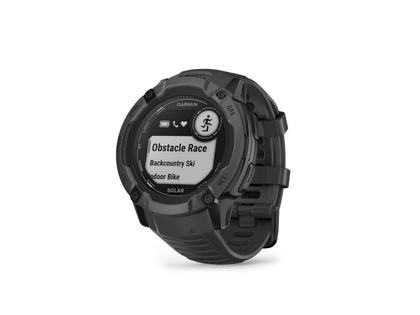 Garmin Instinct 2X Solar faserverstärktes Polymer schiefergrau 50 mm Kautschukband schiefergrau – Damenuhren Uhr Multifunktion aus Kautschuk und Kunststoff. Das Gehäuse ist rund und schwarz. Das Kautschuk / Kunststoff / Silikon Armband ist schwarz. Das Zifferblatt ist digital und schwarz. – Ansicht 2