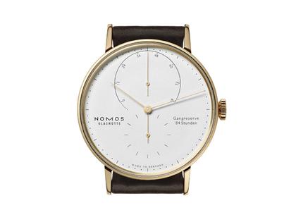 Nomos Glashütte Lambda 39 Handaufzug Roségold 39mm weißes Zifferblatt braunes Lederband – Herrenuhren Uhr ohne Datum aus 750 Rotgold und Leder. Das Gehäuse ist rund und roségold. Das Lederarmband ist braun. Das Zifferblatt ist ein Index in weiß. – Ansicht 4