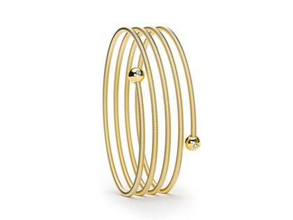 Niessing Colette C Embrace Armreif 4-fach Classic Yellow mit zweifachem Besatz – Armschmuck Armreif aus 750 Gelbgold.