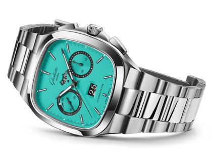 Glashütte Original Seventies Chronograph Panoramadatum Swimming Pool Automatik Edelstahl 40mm türkises Zifferblatt schwarzes Kautschukband limitiert – Herrenuhren Chronograph aus 585 Weißgold, Edelstahl und Kautschuk. Das Gehäuse ist quadratisch und silber. Das Kautschuk / Kunststoff / Silikon Armband ist silber. Das Zifferblatt ist ein Index in türkis. – Ansicht 2