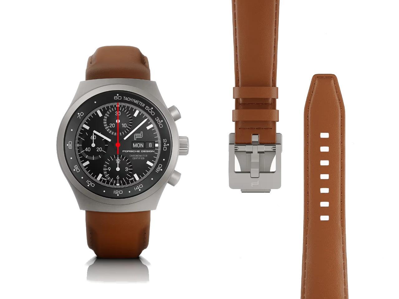 Porsche Design Chronograph 1 - All Titanium Numbered Edition Automatik Titan 40mm schwarzes Zifferblatt braunes Lederband – Herrenuhren Chronograph aus Leder und Titan. Das Gehäuse ist rund und grau. Das Lederarmband ist braun. Das Zifferblatt ist ein Index in schwarz. – Ansicht 2