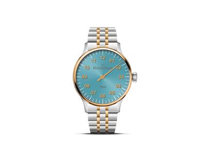 MeisterSinger Yaara Automatik Edelstahl Gold 36mm blaues Zifferblatt Metalllband bicolor – Damenuhren Uhr ohne Datum aus Edelstahl und vergoldet. Das Gehäuse ist rund und silber-gelbgold. Das Edelstahlarmband ist silber-gelbgold. Das Zifferblatt ist arabisch und blau.