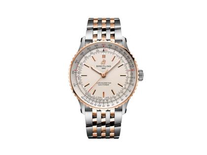 Breitling Navitimer Automatic 41 Chronometer Edelstahl cremefarbenes Zifferblatt zweifarbiges Metallband – Herrenuhren Uhr ohne Datum aus 750 Rotgold und Edelstahl. Das Gehäuse ist rund und silber-rotgold. Das Edelstahlarmband mit Gold ist silber-rotgold. Das Zifferblatt ist ein Index in beige.
