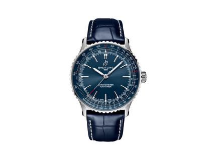 Herrenuhren Uhr ohne Datum aus Edelstahl. Das Gehäuse ist rund und silber. Das Lederarmband Kroko / Alligator ist blau. Das Zifferblatt ist ein Index in blau.