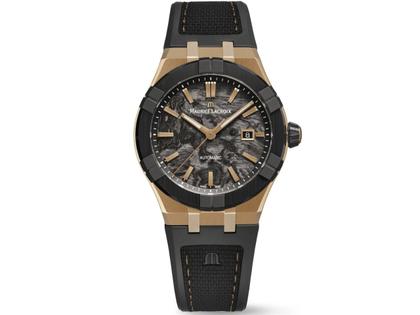 Maurice Lacroix AIKON-IC Frozen Carbon Automatik Bronze 43mm Carbon-Zifferblatt schwarzes Kautschukband limitiert – Herrenuhren Uhr mit Datum aus Bronze, Carbon, Edelstahl, Kautschuk, Keramik und Leder. Das Gehäuse ist rund und bronze. Das Kautschuk / Kunststoff / Silikon Armband ist schwarz. Das Zifferblatt ist ein Index in schwarz.