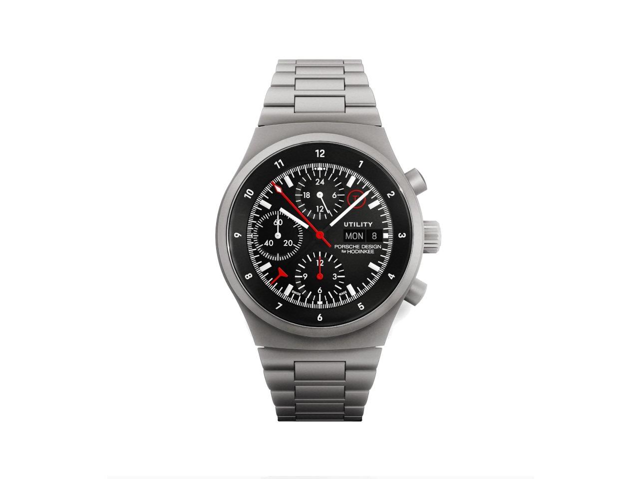 Porsche Design Chronograph 1 - Utility Hodinkee 2026 Limited Edition Automatik Titan 41mm schwarzes Zifferblatt Titanband und Lederband – Herrenuhren Chronograph aus Leder, Titan und Titancarbid beschichtet. Das Gehäuse ist rund und grau. Das Titanarmband ist grau. Das Zifferblatt ist ein Index in schwarz. – Ansicht 4