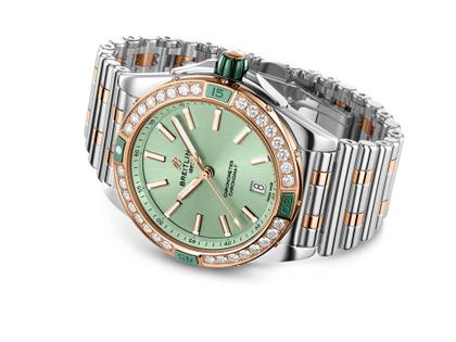 Breitling Super Chronomat Automatic 38 Edelstahl grünes Zifferblatt zweifarbiges Metallband – Damenuhren Uhr mit Datum aus 750 Rotgold, Edelstahl und Keramik. Das Gehäuse ist rund und silber. Das Edelstahlarmband mit Gold ist silber. Das Zifferblatt ist ein Index in grün. – Ansicht 2
