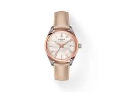 Tissot PR 100 Quarz Edelstahl 34mm weißes Perlmutt-Zifferblatt cremefarbenes Lederband – Damenuhren Uhr mit Datum aus Edelstahl und Leder. Das Gehäuse ist rund und silber. Das Lederarmband ist beige. Das Zifferblatt ist ein Index in weiß.
