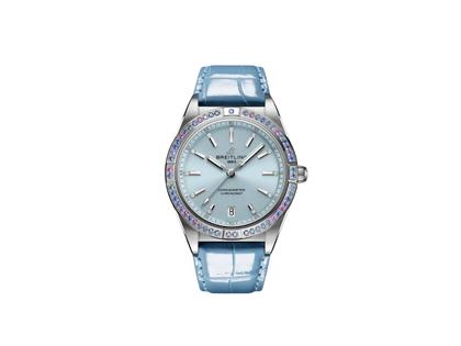 Damenuhren Uhr mit Datum aus 750 Weißgold, Edelstahl und Leder. Das Gehäuse ist rund und silber. Das Lederarmband Kroko / Alligator ist blau. Das Zifferblatt ist ein Index in blau.