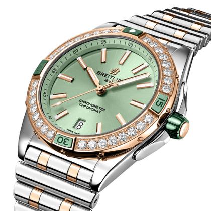 Breitling Super Chronomat Automatic 38 Edelstahl grünes Zifferblatt zweifarbiges Metallband – Damenuhren Uhr mit Datum aus 750 Rotgold, Edelstahl und Keramik. Das Gehäuse ist rund und silber. Das Edelstahlarmband mit Gold ist silber. Das Zifferblatt ist ein Index in grün. – Ansicht 3