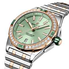 Breitling Super Chronomat Automatic 38 Edelstahl grünes Zifferblatt zweifarbiges Metallband – Damenuhren Uhr mit Datum aus 750 Rotgold, Edelstahl und Keramik. Das Gehäuse ist rund und silber. Das Edelstahlarmband mit Gold ist silber. Das Zifferblatt ist ein Index in grün. – Ansicht 3