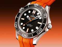 Omega Seamaster Diver 300M Automatik Edelstahl 42mm schwarzes Zifferblatt orangefarbenes Kautschukband – Herrenuhren Uhr ohne Datum aus Aluminium, Edelstahl und Kautschuk. Das Gehäuse ist rund und silber. Das Kautschuk / Kunststoff / Silikon Armband ist orange. Das Zifferblatt ist ein Index in schwarz. – Ansicht 3