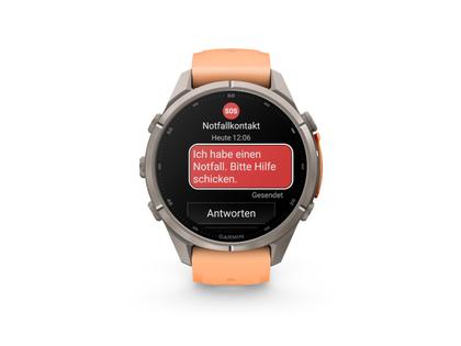 Garmin Fenix 9 Pro inReach Titan 43mm digitales Display orangefarbenes Silikonband – Herrenuhren Uhr Multifunktion aus Kautschuk und Titan. Das Gehäuse ist rund und grau. Das Kautschuk / Kunststoff / Silikon Armband ist orange. Das Zifferblatt ist digital und schwarz.