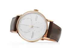 Nomos Glashütte Lambda 39 Handaufzug Roségold 39mm weißes Zifferblatt braunes Lederband – Herrenuhren Uhr ohne Datum aus 750 Rotgold und Leder. Das Gehäuse ist rund und roségold. Das Lederarmband ist braun. Das Zifferblatt ist ein Index in weiß. – Ansicht 2