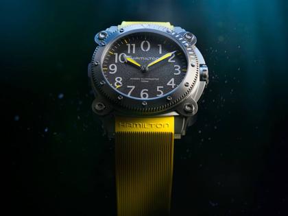 Hamilton Khaki Navy BeLOWZERO Auto Titanium 46mm schwarzes Zifferblatt gelbes Kautschukband – Herrenuhren Uhr ohne Datum aus Kautschuk und Titan. Das Gehäuse ist rund und grau. Das Kautschuk / Kunststoff / Silikon Armband ist gelb. Das Zifferblatt ist arabisch und schwarz. – Ansicht 7