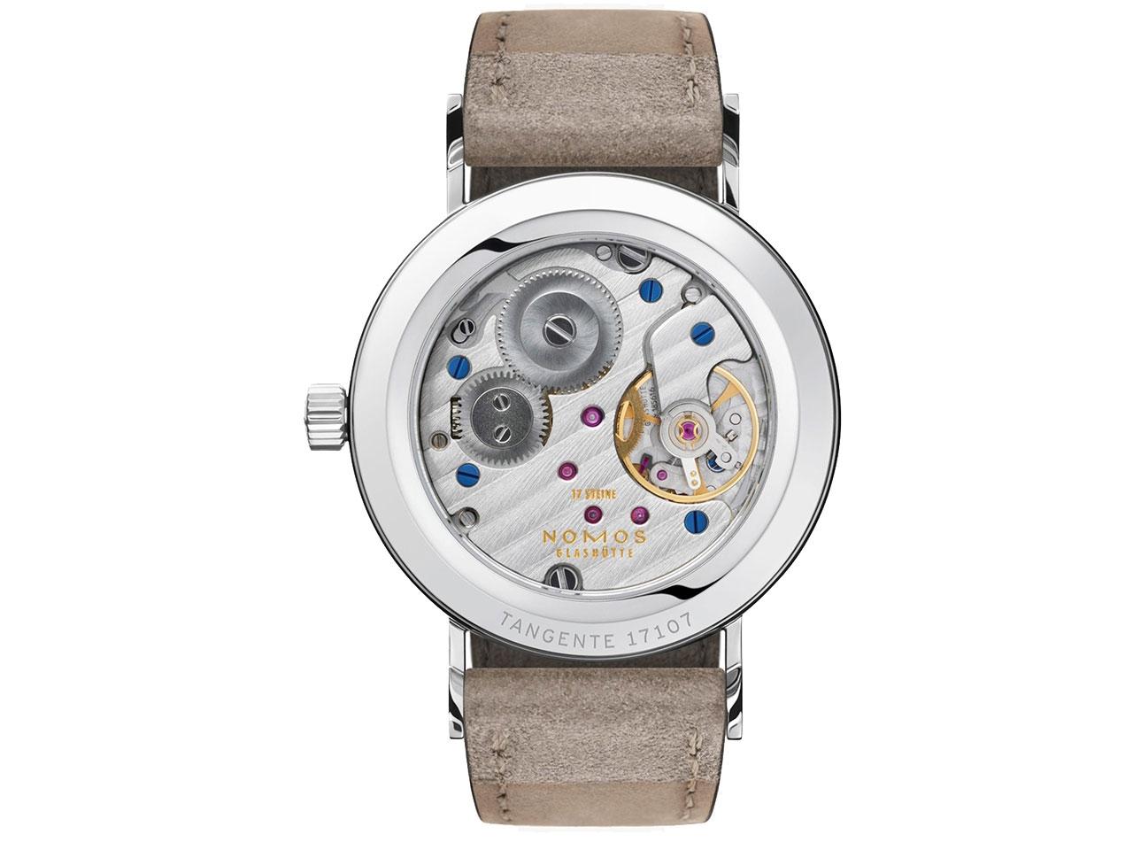 Nomos Glashütte Tangente 33 Duo Handaufzug Edelstahl 33mm weißes Zifferblatt beiges Lederband Glasboden – Damenuhren Uhr ohne Datum aus Edelstahl. Das Gehäuse ist rund und silber. Das Lederarmband ist beige. Das Zifferblatt ist arabisch Index und weiß. – Ansicht 2