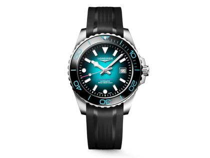 Longines HydroConquest 2026 Commonwealth Games Automatik Edelstahl 42mm türkises Zifferblatt schwarzes Kautschukband – Herrenuhren Uhr mit Datum aus Edelstahl, Kautschuk und Keramik. Das Gehäuse ist rund und silber. Das Kautschuk / Kunststoff / Silikon Armband ist schwarz. Das Zifferblatt ist ein Index in schwarz.