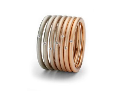 Ringe Ring mit Besatz aus 750 Rotgold, 750 Weißgold und und .