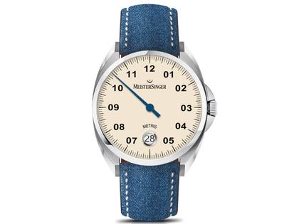 MeisterSinger Metris Elfenbein Jeans – Herrenuhren Uhr mit Datum aus Edelstahl. Das Gehäuse ist rund und silber. Das Textilarmband ist blau. Das Zifferblatt ist arabisch Index und beige.