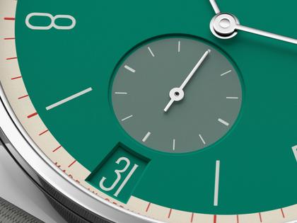 Nomos Glashütte Tangente 38 Datum "175 Years Watchmaking - Schlossgrün" Handaufzug Edelstahl grünes Zifferblatt graues Textilband Glasboden – Herrenuhren Uhr mit Datum aus Edelstahl. Das Gehäuse ist rund und silber. Das Textilarmband ist grau. Das Zifferblatt ist arabisch Index und grün. – Ansicht 6