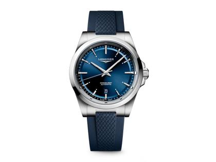 Longines Conquest Automatik Edelstahl 41mm blaues Zifferblatt blaues Kautschukband – Herrenuhren Uhr mit Datum aus Edelstahl. Das Gehäuse ist rund und silber. Das Kautschuk / Kunststoff / Silikon Armband ist blau. Das Zifferblatt ist ein Index in blau.