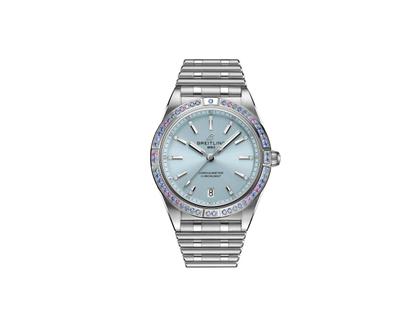 Damenuhren Uhr mit Datum aus 750 Weißgold und Edelstahl. Das Gehäuse ist rund und silber. Das Edelstahlarmband mit Gold ist silber. Das Zifferblatt ist ein Index in blau.