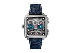 TAG Heuer Monaco Evergraph Automatik Titan 40mm skelettiertes Zifferblatt blaues Kautschukband – Herrenuhren Chronograph aus Titan. Das Gehäuse ist quadratisch und grau. Das Kautschuk / Kunststoff / Silikon Armband ist blau. Das Zifferblatt ist ein Index in silber.
