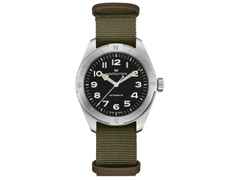 Hamilton Khaki Field Expedition Automatik Edelstahl 41mm schwarzes Zifferblatt olivgrünes Textilband – Herrenuhren Uhr ohne Datum aus Edelstahl. Das Gehäuse ist rund und silber. Das Textilarmband ist grün. Das Zifferblatt ist ein Index in schwarz.