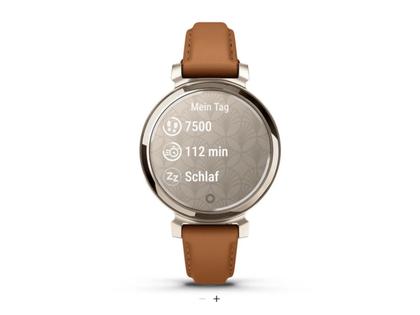 Garmin Lily 2 Smartwatch Aluminium eloxiert 35mm cremegoldfarbenes Display tanbraunes Lederband – Damenuhren Uhr Multifunktion aus eloxiertes Aluminium, Kunststoff und Polyamid. Das Gehäuse ist rund. Das Lederarmband ist braun. Der Zifferblatt ist digital. – Ansicht 2