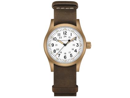 Herrenuhren Uhr ohne Datum aus Bronze und Titan. Das Gehäuse ist rund und bronze. Das Lederarmband ist braun. Das Zifferblatt ist arabisch Index und weiß.