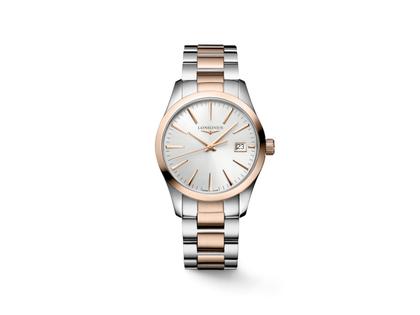 Longines Conquest Classic Quarz Edelstahl 34mm silbernes Zifferblatt Metallband – Damenuhren Uhr mit Datum aus Edelstahl. Das Gehäuse ist rund und silber-roségold. Das Edelstahlarmband ist silber-roségold. Das Zifferblatt ist ein Index in silber.