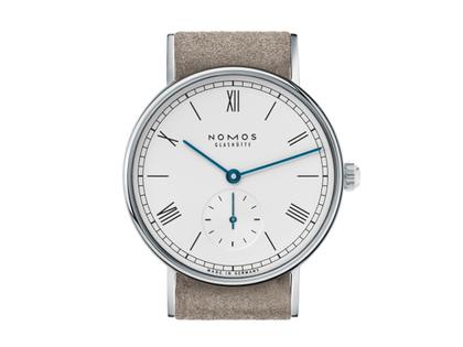 Nomos Glashütte Ludwig 33 Handaufzug Edelstahl weißes Zifferblatt braunes Lederband Glasboden – Damenuhren Uhr ohne Datum aus Edelstahl und Leder. Das Gehäuse ist rund und silber. Das Lederarmband ist beige. Das Zifferblatt ist römisch Index und weiß. – Ansicht 2