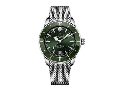 Herrenuhren Uhr mit Datum aus Edelstahl und Keramik. Das Gehäuse ist rund und silber. Das Edelstahlarmband ist silber. Das Zifferblatt ist ein Index in grün.