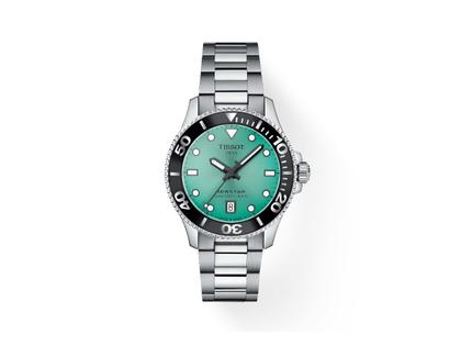 Tissot Seastar 1000 Quarz Edelstahl 36mm türkises Zifferblatt Metallband – Damenuhren Uhr mit Datum aus Edelstahl. Das Gehäuse ist rund und silber. Das Edelstahlarmband ist silber. Das Zifferblatt ist ein Index in türkis.