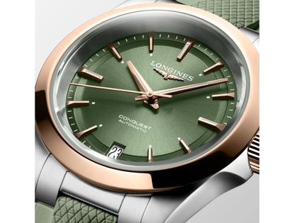 Longines Conquest Automatik Edelstahl 34mm grünes Zifferblatt grünes Kautschukband – Damenuhren Uhr mit Datum aus 750 Rotgold und Edelstahl. Das Gehäuse ist rund und silber. Das Kautschuk / Kunststoff / Silikon Armband ist grün. Das Zifferblatt ist ein Index in grün. – Ansicht 5