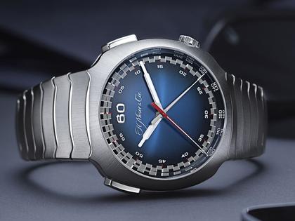 H. Moser & Cie. Streamliner Flyback Chronograph Funky Blue Automatic Edelstahl 42mm blaues Zifferblatt Metallband – Herrenuhren Chronograph aus Edelstahl. Das Gehäuse ist rund und silber. Das Edelstahlarmband ist silber. Das Zifferblatt ist arabisch und blau. – Ansicht 2