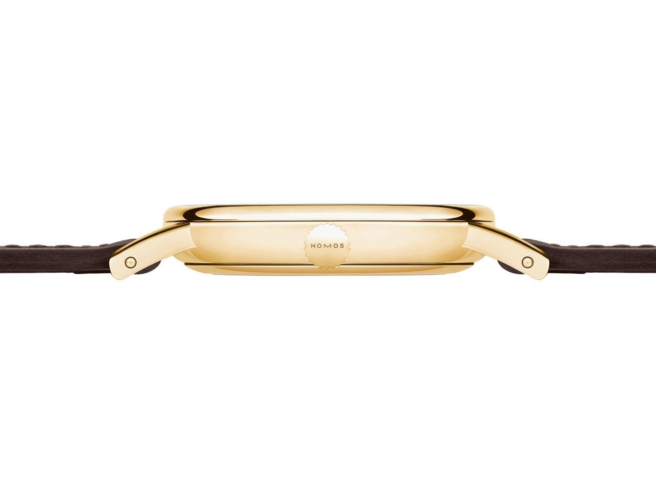 Nomos Glashütte Ludwig 33 Gold Handaufzug Gelbgold weißes Zifferblatt braunes Lederband – Damenuhren Uhr ohne Datum aus 750 Gelbgold. Das Gehäuse ist rund und roségold. Das Lederarmband ist braun. Das Zifferblatt ist römisch Index und weiß. – Ansicht 2