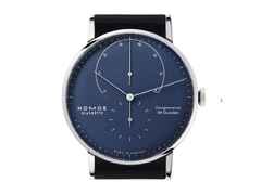 Nomos Glashütte Lambda 42 Tiefblau Handaufzug Weißgold 42mm blaues Zifferblatt schwarzes Lederband – Herrenuhren Uhr ohne Datum aus 750 Weißgold und Leder. Das Gehäuse ist rund und silber. Das Lederarmband ist schwarz. Das Zifferblatt ist ein Index in blau. – Ansicht 2