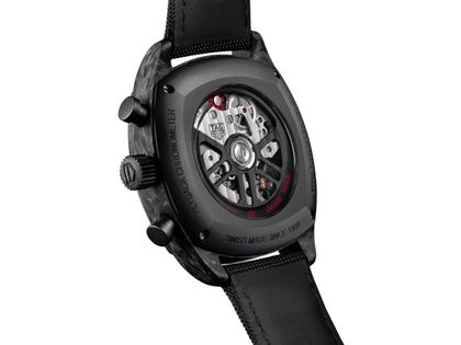 TAG Heuer Monza Flyback Chronometer Automatik Carbon 42mm skelettiertes Zifferblatt schwarzes Textilband – Herrenuhren Chronograph aus DLC beschichtet, Edelstahl, Carbon und Leder. Das Gehäuse ist quadratisch und schwarz. Das Lederarmband ist schwarz. Das Zifferblatt ist ein Index in grau. – Ansicht 4