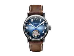 H. Moser & Cie. Heritage Tourbillon Funky Blue Automatik Edelstahl 42mm blaues Zifferblatt braunes Lederband – Herrenuhren Uhr ohne Datum aus Edelstahl. Das Gehäuse ist rund und silber. Das Lederarmband ist braun. Das Zifferblatt ist ein Index in blau.