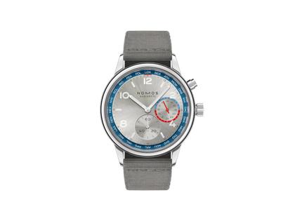 Herrenuhren Uhr ohne Datum aus Edelstahl. Das Gehäuse ist rund und silber. Das Textilarmband ist grau. Das Zifferblatt ist arabisch Index und mehrfarbig.