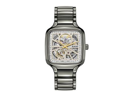 Rado True Square Open Heart Automatik Keramik 38mm skelettiertes Zifferblatt mit Brillanten Keramikband – Herrenuhren Uhr ohne Datum aus Keramik, rhodiniert und Titan. Das Gehäuse ist quadratisch und grau. Das Keramikarmband ist grau. Das Zifferblatt ist skelettiert und grau.