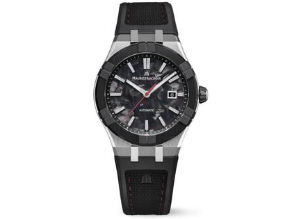 Maurice Lacroix AIKON-IC Frozen Carbon Automatik Edelstahl 43mm Carbon-Zifferblatt schwarzes Kautschukband – Herrenuhren Uhr mit Datum aus Carbon, Edelstahl, Kautschuk und Keramik. Das Gehäuse ist rund und silber. Das Kautschuk / Kunststoff / Silikon Armband ist schwarz. Das Zifferblatt ist ein Index in schwarz.