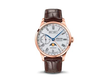 Herrenuhren Uhr mit Datum aus 750 Rotgold und Leder. Das Gehäuse ist rund und roségold. Das Lederarmband ist braun. Das Zifferblatt ist arabisch römisch und weiß.