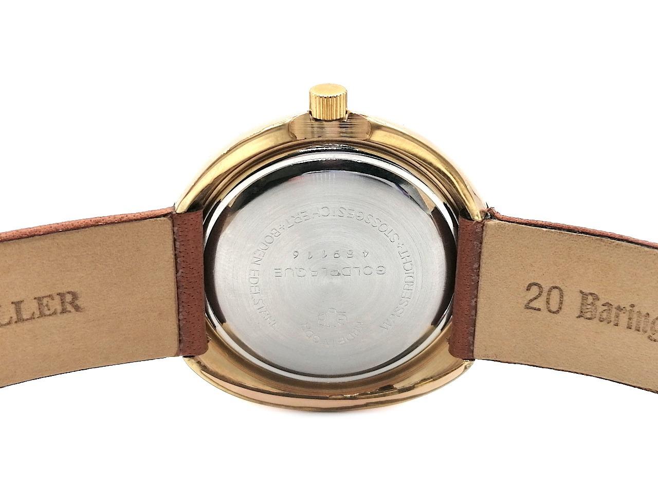 Glashütte Original GUB Glashütte Spezimatic "Ufo" Messing vergoldet 42mm Lederband Kaliber 75 Occasion Refurbished – Herrenuhren Uhr mit Datum aus Messing. Das Gehäuse ist rund und gelbgold. Das Lederarmband ist braun. Das Zifferblatt ist ein Index in braun. – Ansicht 2