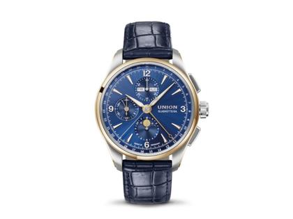 Herrenuhren Chronograph aus 750 Rotgold, Edelstahl und Leder. Das Gehäuse ist rund und silber. Das Lederarmband ist blau. Das Zifferblatt ist arabisch Index und blau.